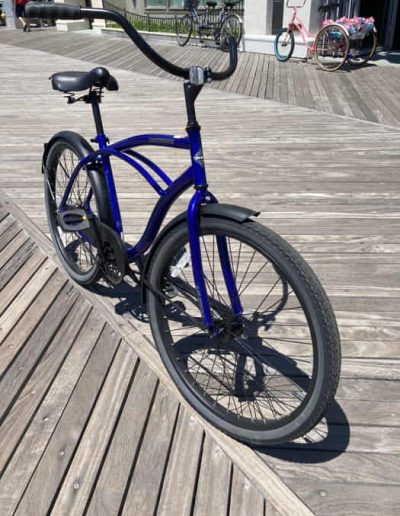 Blue Racing cycle at the board walk bike shop by The cycles of life